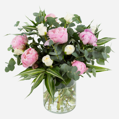 Pink Clouds - This dreamy vase arrangement promises to make a lasting impression. Beautiful peonies are combined with choice complementary flowers and foliage.
