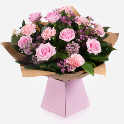 Strawberry Twist - This sweet arrangement of roses with carnations and foliage to compliment. Your recipient is sure to be overjoyed at such a heartfelt statement.